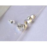 WITHDRAWN!! A COLLECTION OF THREE LOOSE PEAR CUT DIAMONDS. (approx 4mm x 3mm, in bag stating 0.