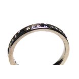 AN 18CT GOLD, WHITE SAPPHIRE AND DIAMOND HALF ETERNITY RING Having five round cut sapphires,