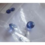 A COLLECTION OF LOOSE CUT SAPPHIRES Comprising two 5mm round cut stones, three 3mm stones and a