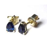 A 9CT WHITE GOLD AND SAPPHIRE STUD EARRINGS Each set with a single pear cut sapphire.