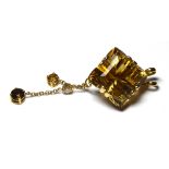 AN 18CT GOLD DIAMOND AND CITRINE PENDANT The Princess cut citrine with diamond drop. (approx 1.5cm x