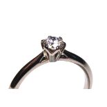 AN 18CT WHITE GOLD AND ROUND BRILLIANT CUT DIAMOND SOLITAIRE RING Complete with IGI certificate. (