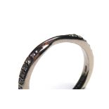AN 18CT WHITE GOLD AND DIAMOND HALF ETERNITY RING having two rows of round cut diamonds in a half