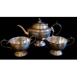 AN EARLY 20TH CENTURY SILVER TEA SET Comprising a teapot, sugar basin and cream jug, hallmarked