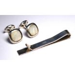 A .925 SILVER MONEY CLIP Along with a pair of silver and enamelled cufflinks.