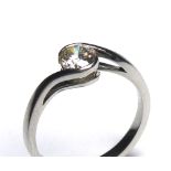 AN 18CT WHITE GOLD AND DIAMOND SOLITAIRE RING The single round cut diamond in a half twist mount (