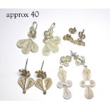 A COLLECTION OF SILVER FILIGREE EARRINGS Organic form. (approx 40)