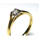 AN 18CT GOLD AND DIAMOND SOLITAIRE RING The single round cut diamond in a raised mount (size M). (