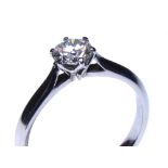 A PLATINUM AND ROUND BRILLIANT CUT DIAMOND SOLITAIRE RING Complete with GIA certificate. (diamond