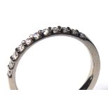 AN 18CT WHITE GOLD AND DIAMOND HALF ETERNITY RING Having a single row of round cut diamonds (size