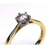 AN 18CT GOLD AND ROUND BRILLIANT CUT DIAMOND SOLITAIRE RING Complete with IGI certificate (size K/