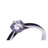 AN 18CT WHITE GOLD AND ROUND BRILLIANT CUT DIAMOND SOLITAIRE RING Complete with IGI certificate. (