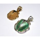 A COLLECTION OF SILVER SCARAB FORM CHARMS Each having green enamel decoration and marked ?Cred?. (