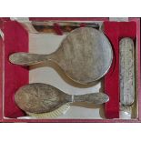 A CASED 20TH CENTURY SILVER VANITY BRUSH AND COMB SET Comprising a hand mirror, hair and clothes