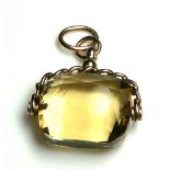 A VICTORIAN 9CT ROSE GOLD AND CITRINE SWIVEL FOB The rectangular for stone with gold Albert link