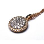 AN 18CT GOLD AND DIAMOND PENDANT NECKLACE Pave set diamonds in a spherical design. (approx