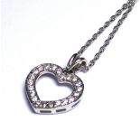 A 9CT WHITE GOLD AND DIAMOND HEART SHAPED PENDANT ON CHAIN.