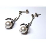 A PAIR OF 18CT GOLD AND PEARL DROP EARRINGS Each having a single pearl held in a Gothic form