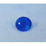 A ROYAL BLUE ROUND BRILLIANT CUT NATURAL SAPPHIRE Complete with PGTL certificate. (weight 0.63ct) (