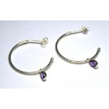 THREE PAIRS OF WHITE METAL HOOP EARRINGS Set with amethysts.