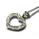 A 9CT WHITE GOLD AND DIAMOND PENDANT NECKLACE Heart form set with round cut diamonds. (approx 1cm