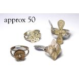 A COLLECTION OF SILVER FILIGREE RINGS Organic form. (approx 50)