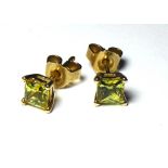 A PAIR OF 9CT GOLD AND YELLOW SAPPHIRE STUD EARRINGS Each set with a Princess cut stone.