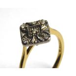 AN ART DECO DESIGN 18CT GOLD AND DIAMOND RING Having an arrangement of pavé set diamonds (size M).