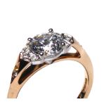 AN 18CT ROSE GOLD AND CUBIC ZIRCONIA DRESS RING Having a single round cut stone (size N).