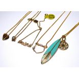 FIVE VARIOUS YELLOW METAL PENDANTS ON CHAINS.