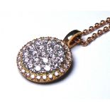 AN 18CT GOLD AND DIAMOND PENDANT NECKLACE The arrangement of diamonds in a spherical design. (approx