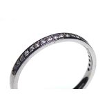 AN 18CT WHITE GOLD AND DIAMOND HALF ETERNITY RING Having a single row of round cut diamonds (size