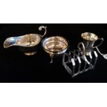 A COLLECTION OF VICTORIAN AND LATER SILVER WARE To include a sauce boat, hallmarked Birmingham,