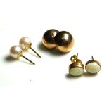 A PAIR OF 18CT GOLD AND PEARL EARRINGS Set with a single pearl ,together with two pairs of 9ct