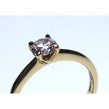 AN 18CT GOLD AND ROUND BRILLIANT CUT DIAMOND SOLITAIRE RING Complete with GIA certificate (size