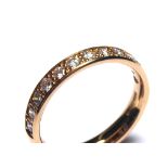 AN 18CT ROSE GOLD AND FAIR TRADE DIAMOND HALF ETERNITY RING Having a single row of round cut