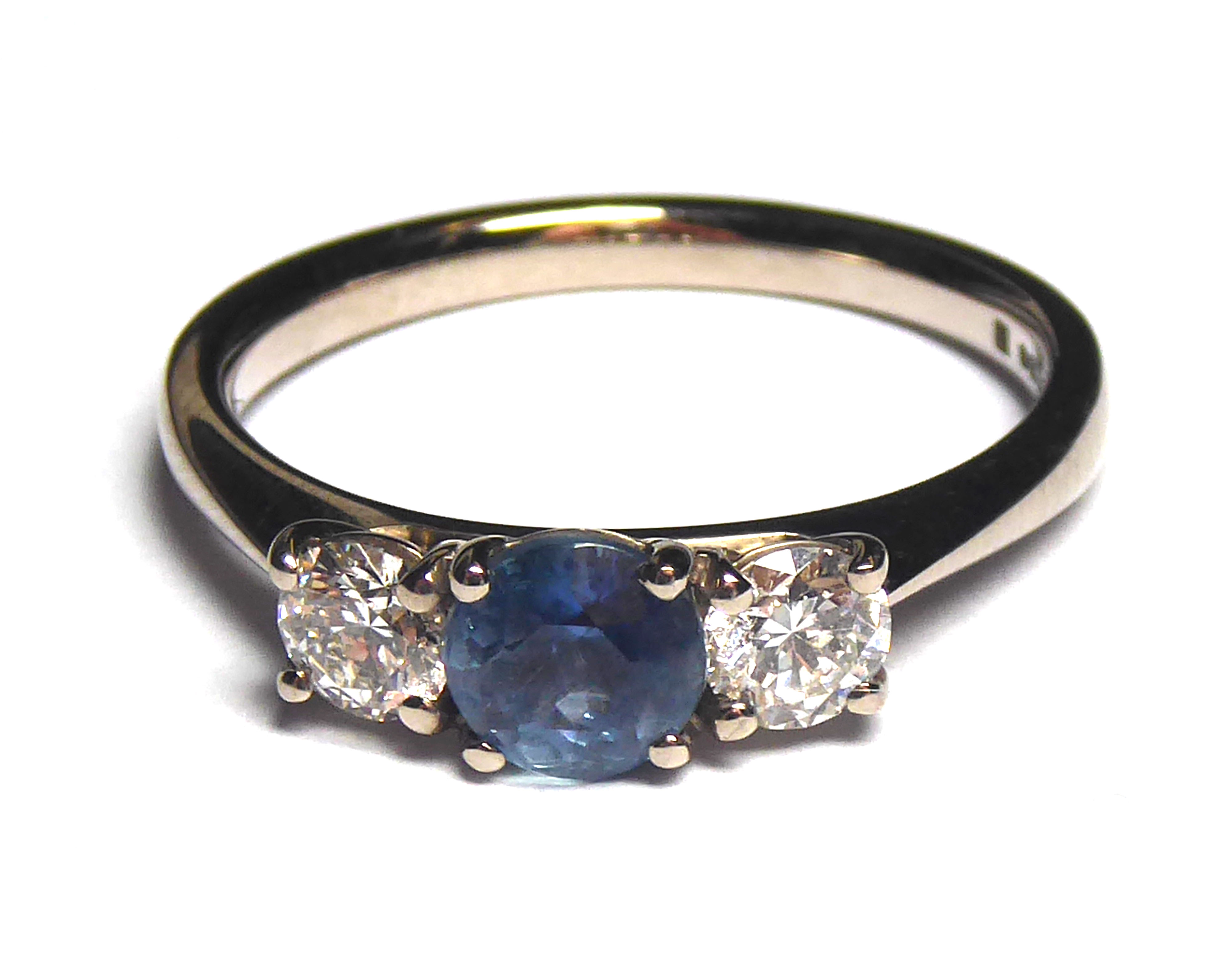AN 18CT WHITE GOLD, SAPPHIRE AND DIAMOND THREE STONE RING Having a round cut sapphire flanked with - Image 2 of 2