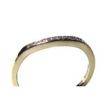 AN 18CT WHITE GOLD AND DIAMOND HALF ETERNITY RING Having a single row of diamonds in a swept