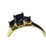 A 9CT GOLD AND SAPPHIRE THREE STONE RING Having an arrangement of graduating stones (size N).