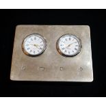 A MILLENNIUM SILVER DOUBLE TIME ZONE CLOCK Two dials on silver clad easel stand, hallmarked
