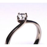 AN 18CT WHITE GOLD AND ROUND BRILLIANT CUT DIAMOND SOLITAIRE RING Complete with IGI certificate. (