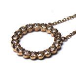 A 9CT GOLD AND DIAMOND PENDANT NECKLACE Circular form set with round cut diamonds. (approx
