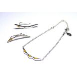 A COLLECTION OF SILVER AND ENAMEL NECKLACES,BRACELETS AND MATCHING EARRINGS Geometric form with