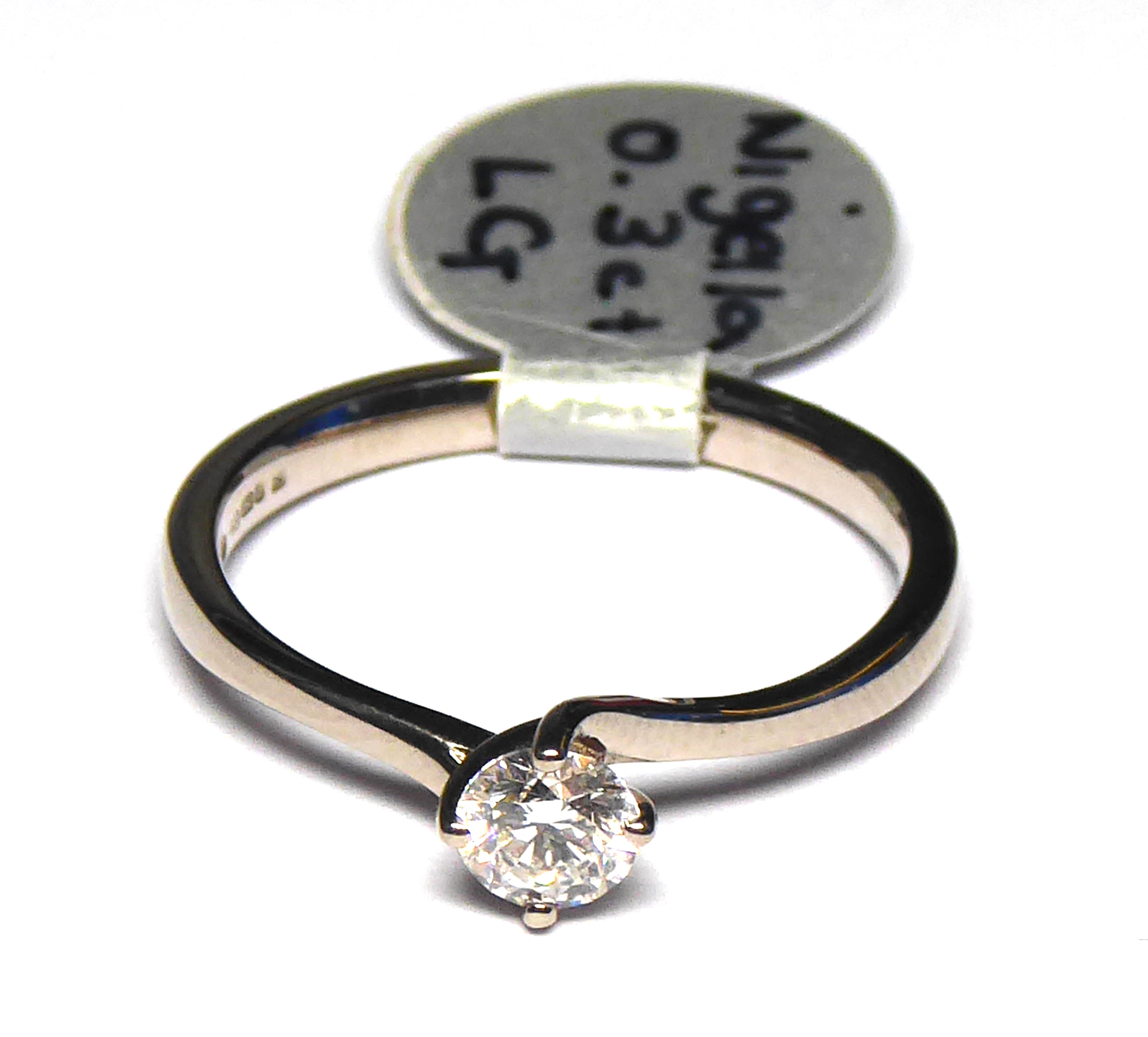 AN 18CT WHITE GOLD AND ROUND BRILLIANT CUT DIAMOND SOLITAIRE RING Complete with IGI certificate. ( - Image 2 of 3