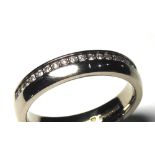 AN 18CT WHITE GOLD AND DIAMOND HALF ETERNITY RING Having a single row of diamonds in an offset