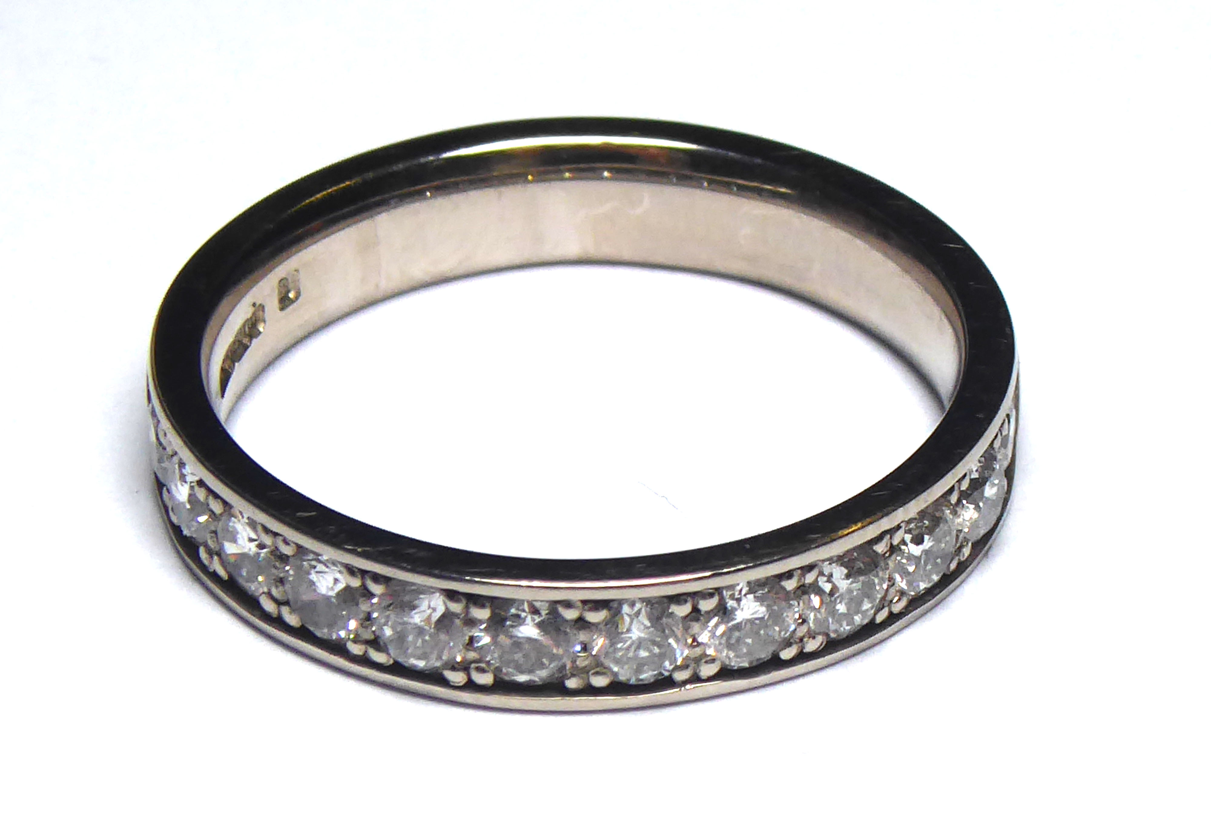 AN 18CT WHITE GOLD AND DIAMOND HALF ETERNITY RING Having a single row of round cut diamonds (size - Image 2 of 2