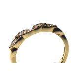 AN 18CT GOLD AND DIAMOND HALF ETERNITY RING Having an arrangement of diamonds forming a leaf