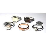 A COLLECTION OF SILVER WEDDING BANDS Including white silver and silver gilt. (approx 25)