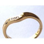 AN 18CT GOLD AND DIAMOND WEDDING RING Having a single row of diamonds in a 'V' form design (size M).