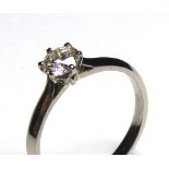 AN 18CT WHITE GOLD AND DIAMOND SOLITAIRE RING Having a single round cut diamond. (approx total